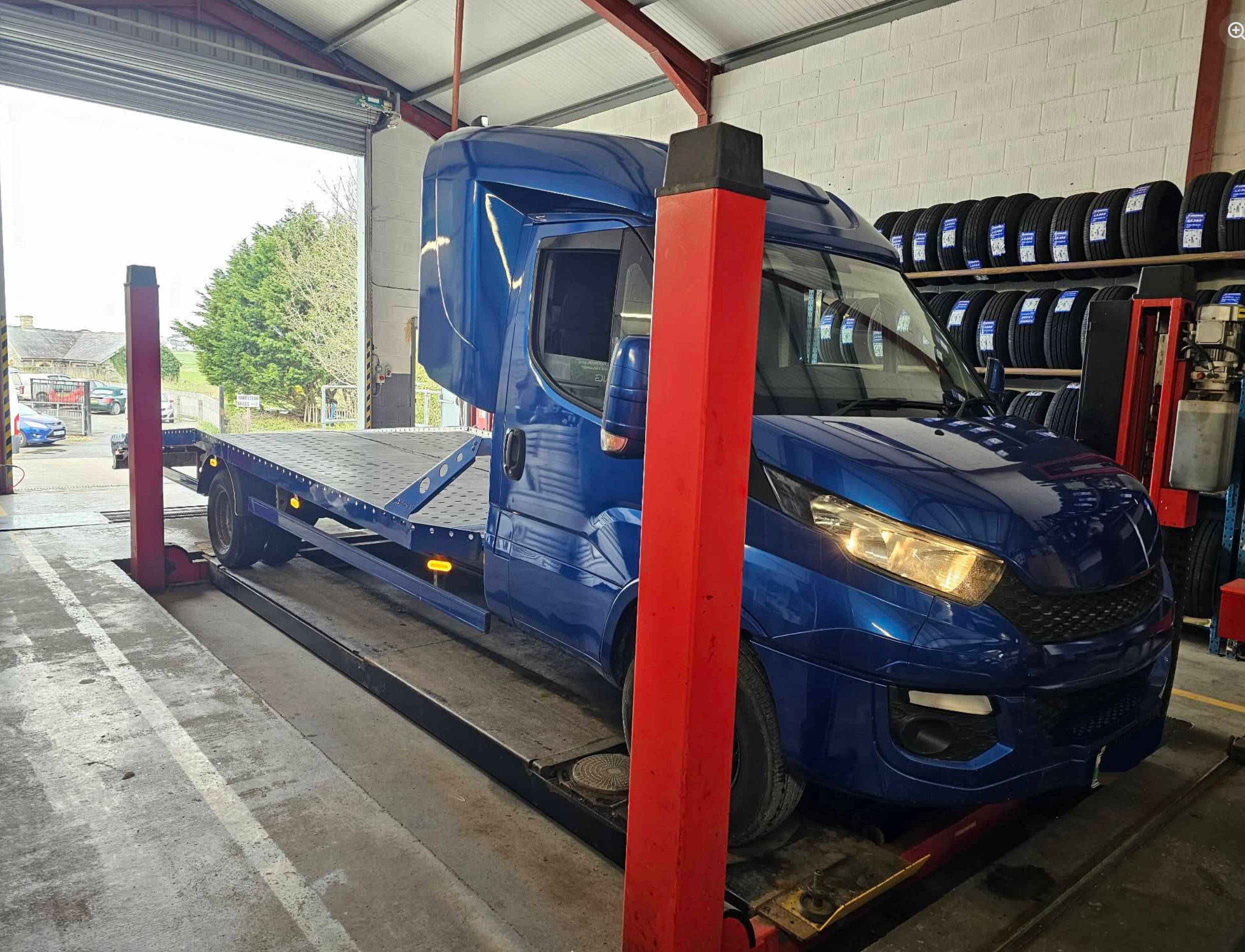 Class 7 MOT test at Modurol Dyfi Tywyn &mdash; commercial vehicle on hydraulic lift in the workshop